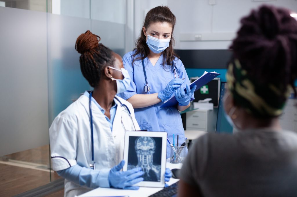 Doctor and nurse discussing treatment